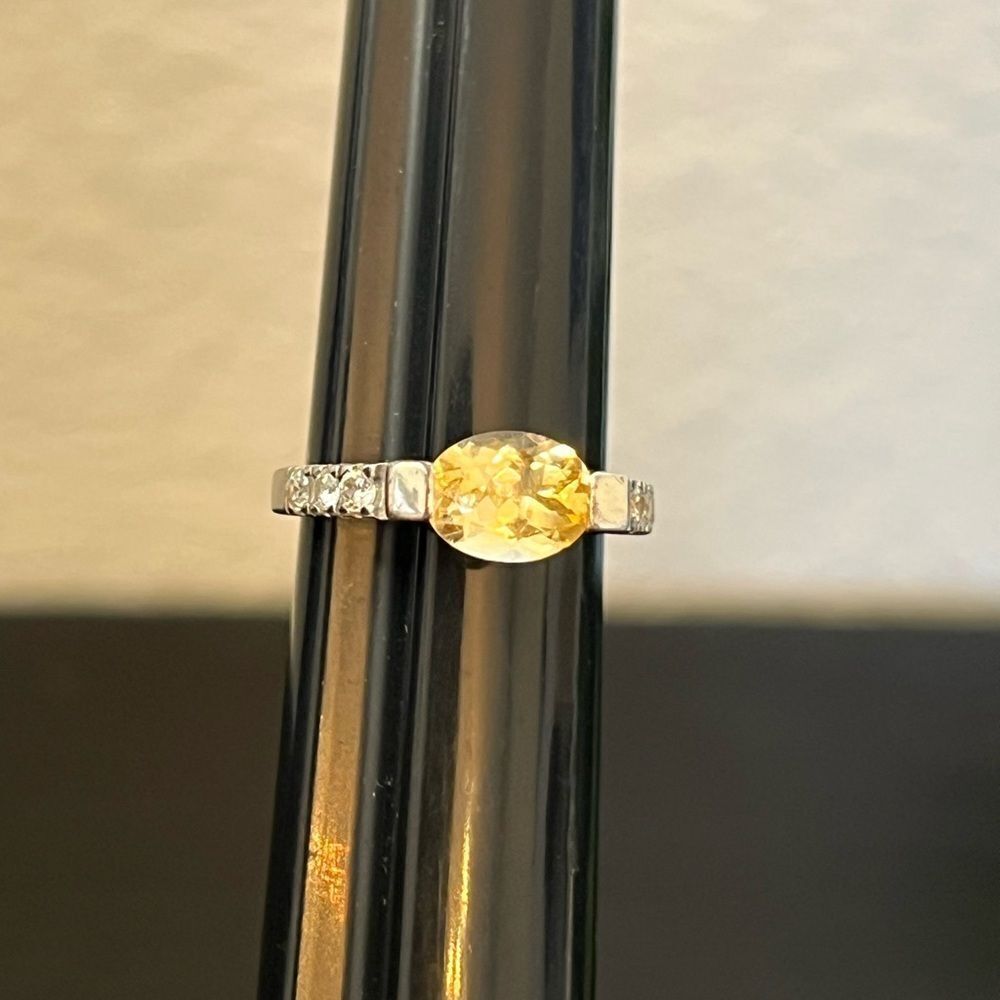 Elegant Silver and Yellow Gemstone Ring